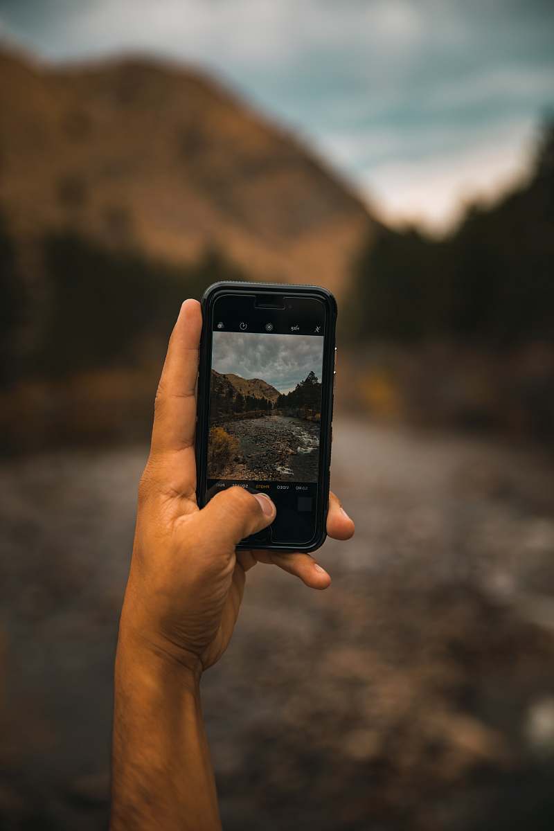 mobile phone person taking photo of mountain cell phone